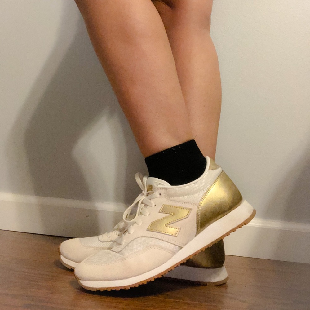 Gold New Balance sneakers